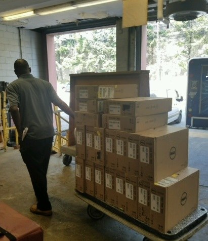 Computers on a hand truck in the loading dock