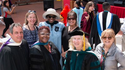 Dean Becker (far right front) and Professor Donald Auriama (far left front), with OT faculty colleagues.