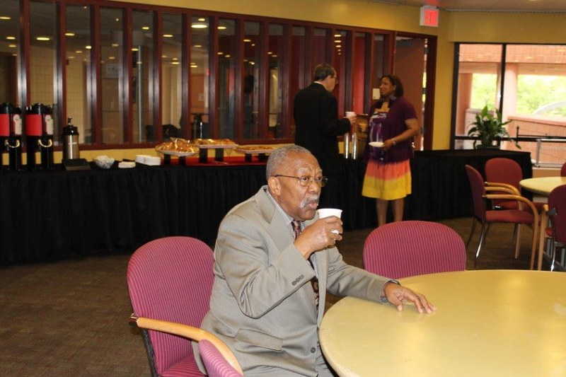 Alum, Victor Richards enjoying a cup of coffee