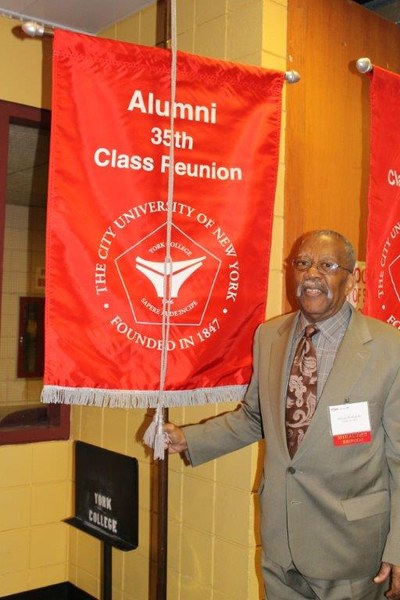 Victor Richards carrying his 35th Class Reunion Class banner