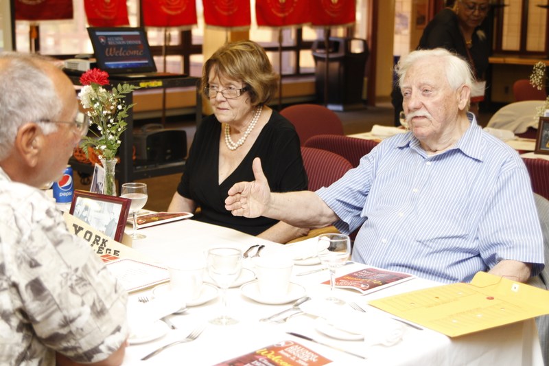 Alums and retired faculty are engaged in conversation