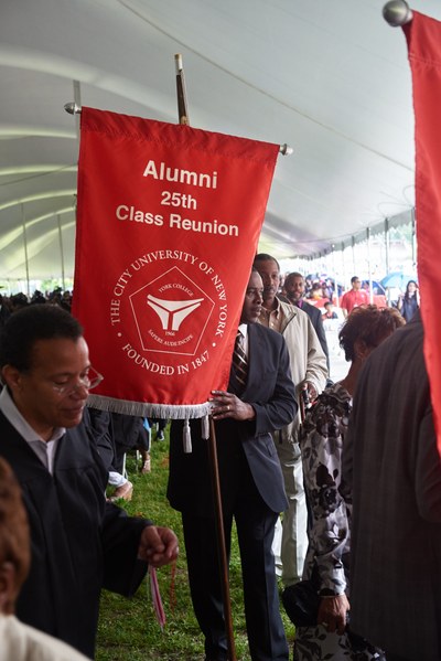 Alums with 25th Class Reunion banner