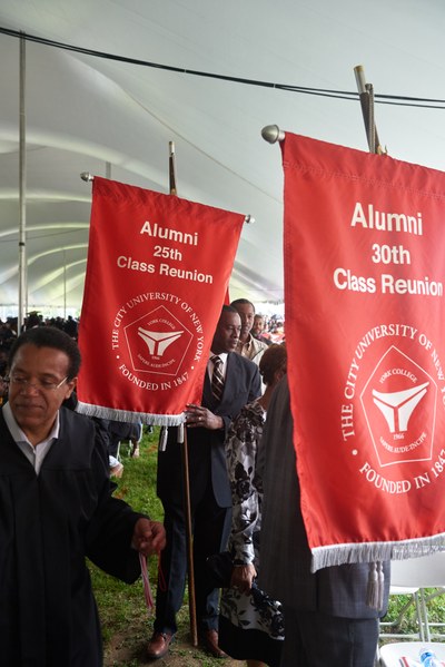 Alums carrying their Class banner