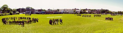 Groups of students in the athletics field