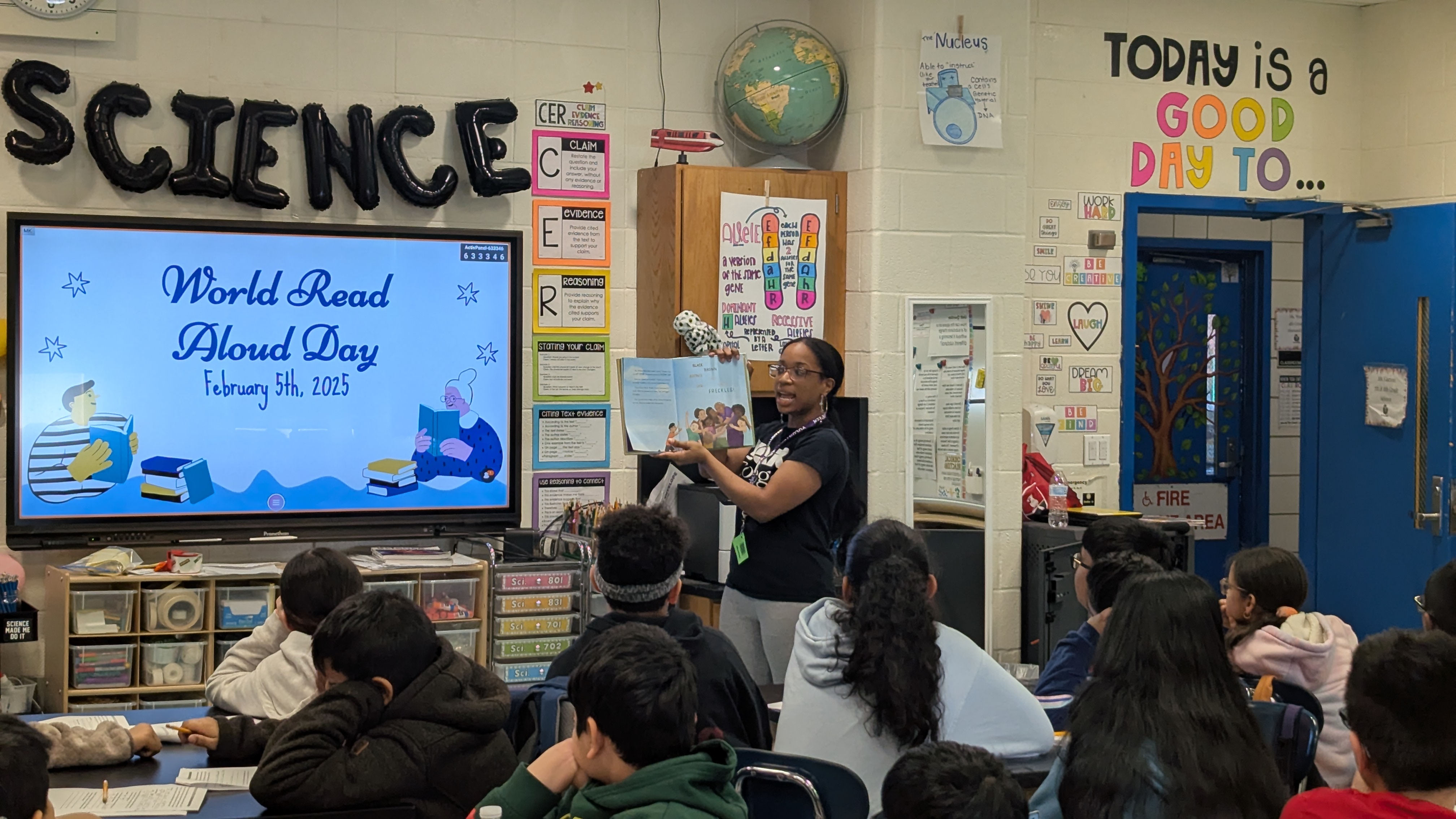 A Project Serve volunteer reads to a class.