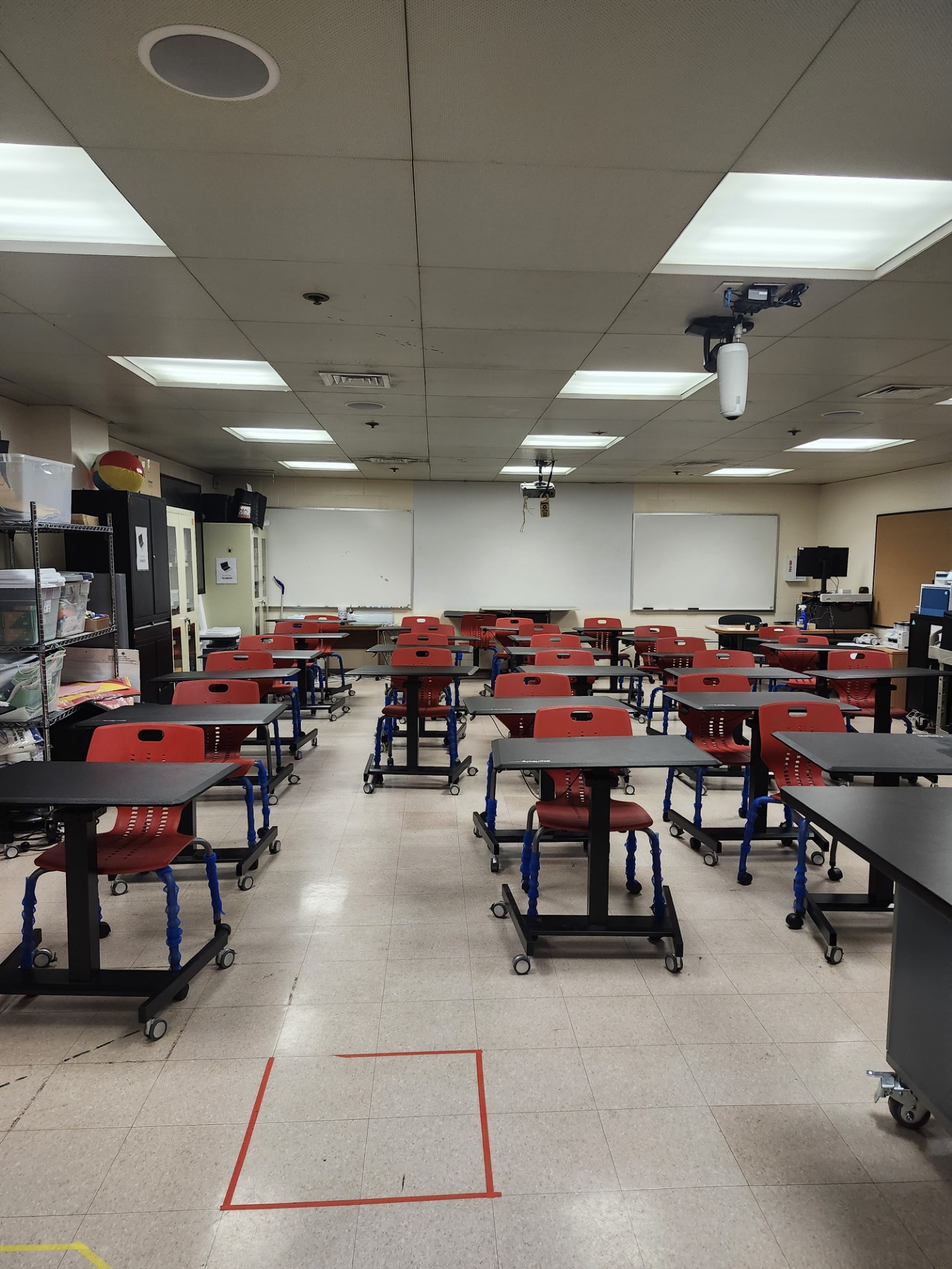 MakerSpace with 3d printers, Cricut makers, laser cutter, robotics, laptops, ipads, games, DIY tools. (the red square on the floor is a challenge game designed the robotics team for events)