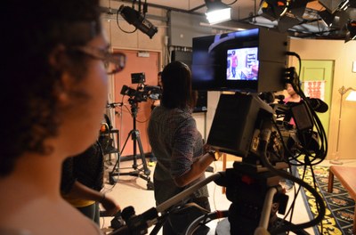 A student uses a camera at the York College Television Studio during a shoot.