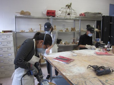 Department of Performing and Fine Arts students working during a sculpture class.