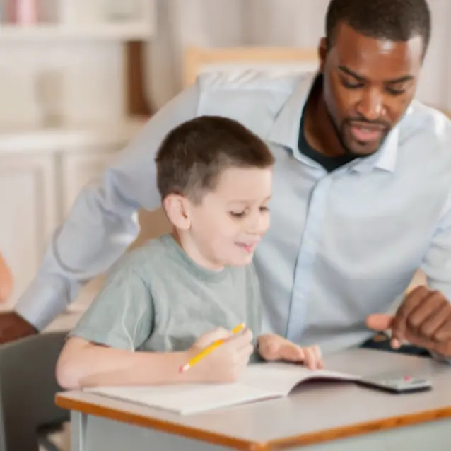 Teacher assisting student with math