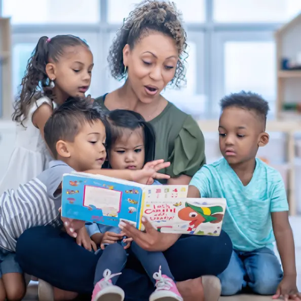 Teacher reading to preschool children